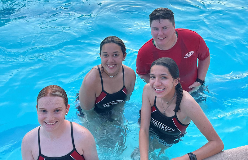 Live Oak city pool lifeguards in the pool